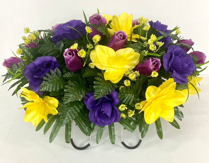 Cemetery Headstone Saddle Flower Arrangement with Mixed Purple Roses, Yellow Flowers, and Green Ferns for Spring and Summer